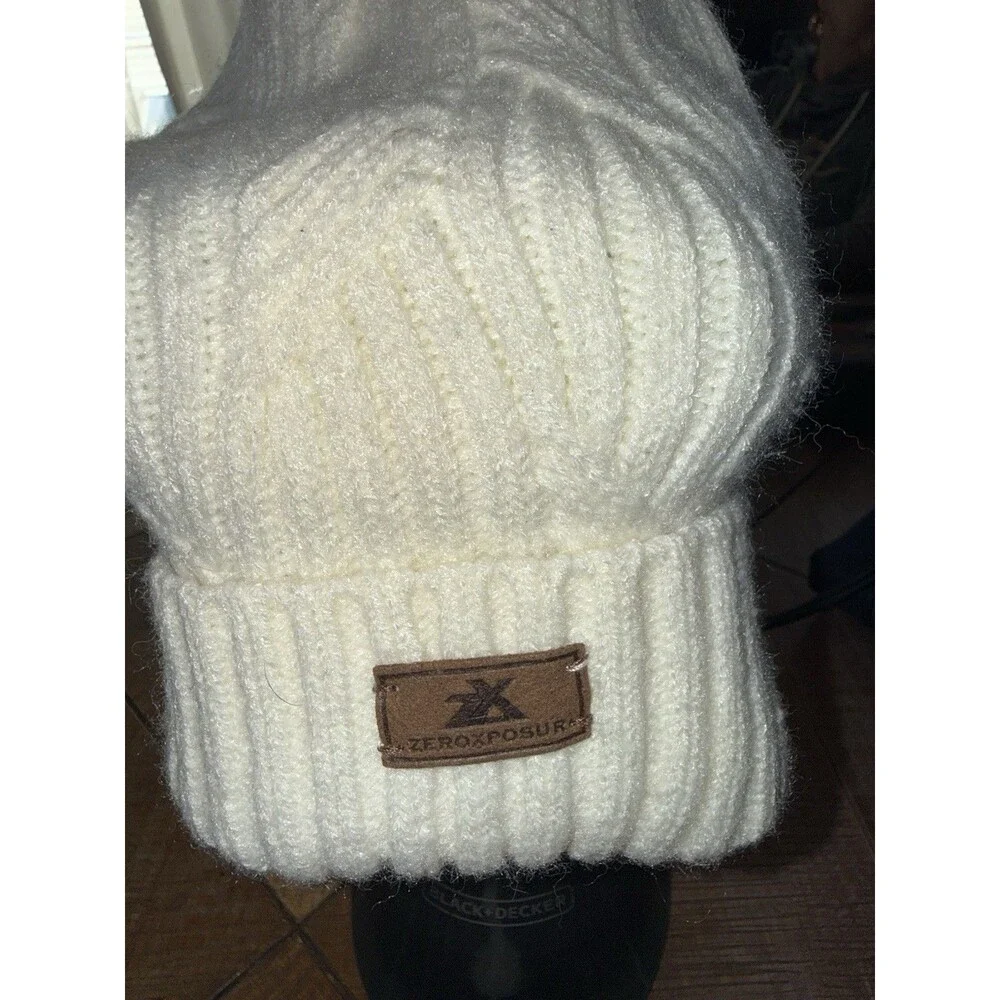 ZeroXposur women's cream knit beanies with a faux fur pom-pom